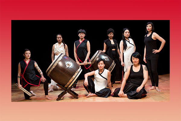 eight asian women with taiko drums